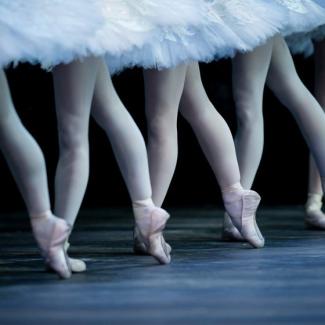 Ballet dancers' legs en pointe.
