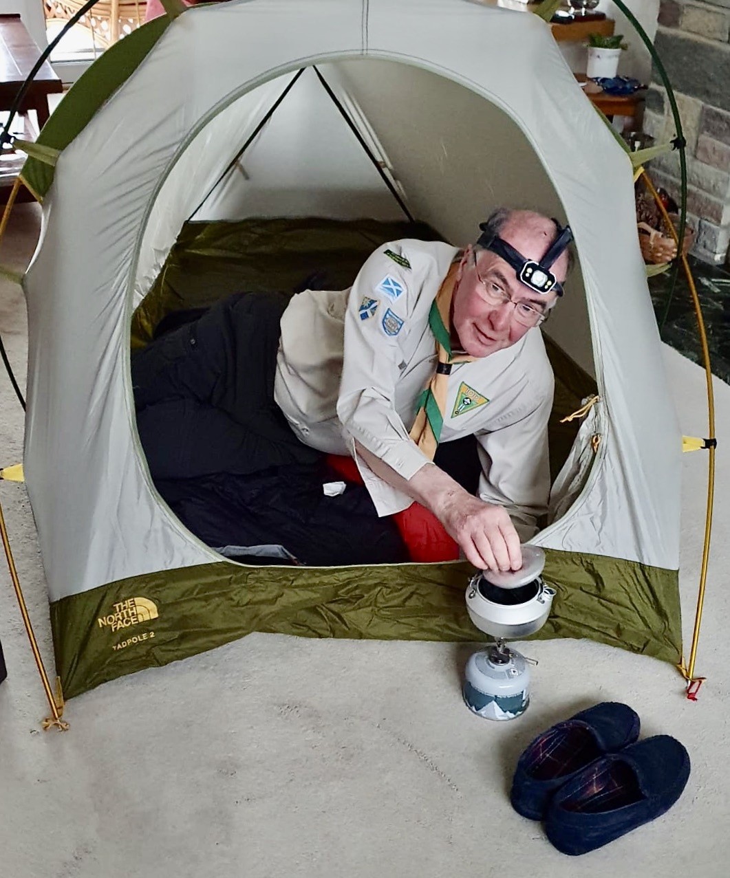 Indoor tent with adult scout in it