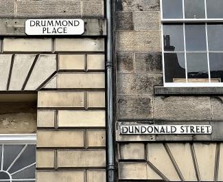 New Town stonework and downpipes at the intersection of Drummond Place and Dundonald Street.