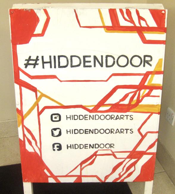Hidden Door sign