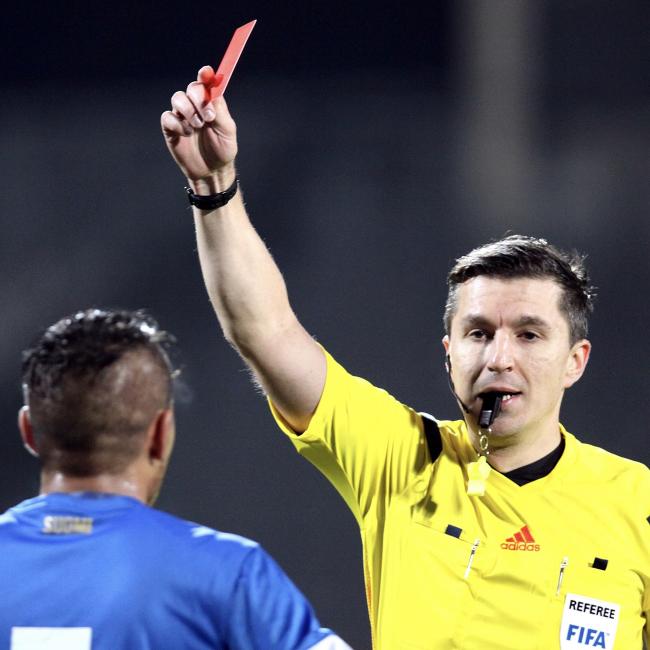 Referee showing a red card