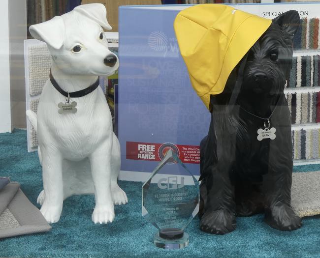 Model dogs in shop window.